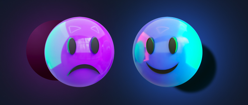 Une paire d’émojis colorés aux expressions distinctes, représentant le spectre émotionnel des traders forex pendant l’analyse.